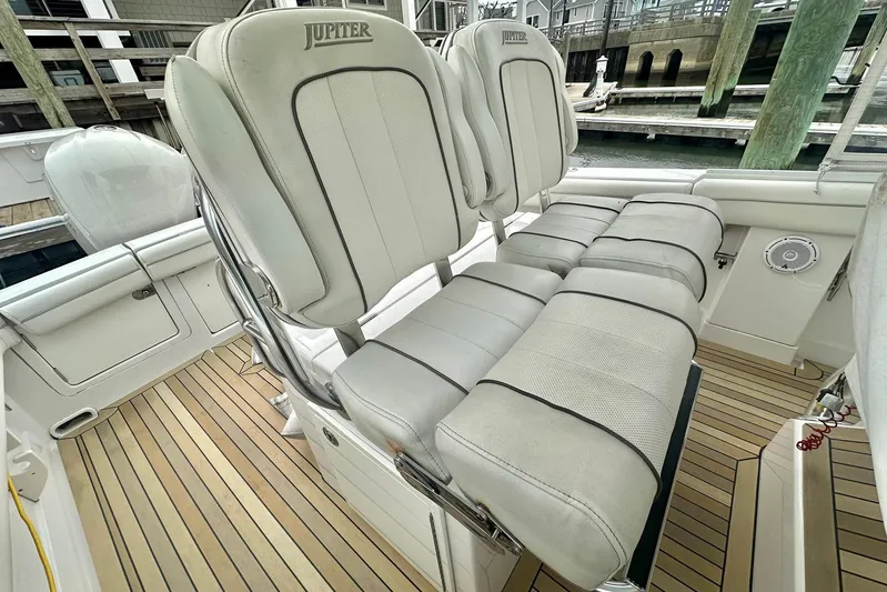 Warden Pass Too Yacht Photos Pics 2013 Jupiter 30 Center Console boat with cushioned seating and teak flooring.