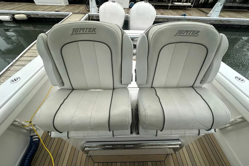 Warden Pass Too Yacht Photos Pics 2013 Jupiter 30 Center Console boat seats, white upholstery, docked at marina.