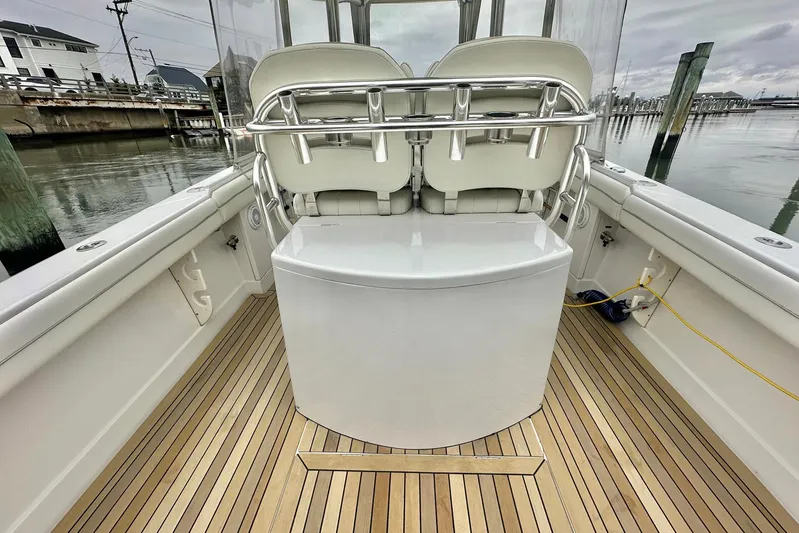 Warden Pass Too Yacht Photos Pics 2013 Jupiter 30 Center Console boat interior with sleek seating and wooden deck.