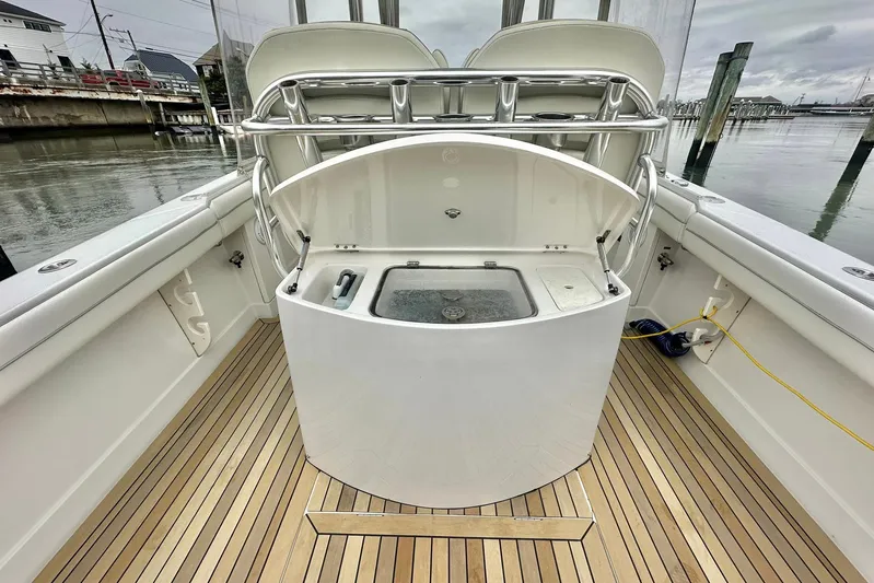 Warden Pass Too Yacht Photos Pics 2013 Jupiter 30 Center Console boat interior with teak flooring and fishing station.