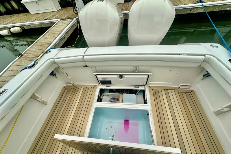 Warden Pass Too Yacht Photos Pics 2013 Jupiter 30 Center Console boat interior with open storage compartments at dock.