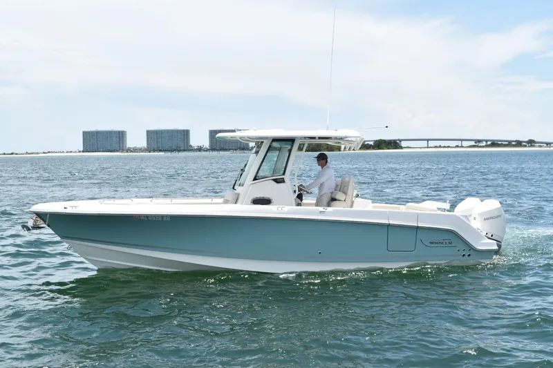  Yacht Photos Pics 2023 Boston Whaler 280 Outrage cruising on open water under a clear sky.
