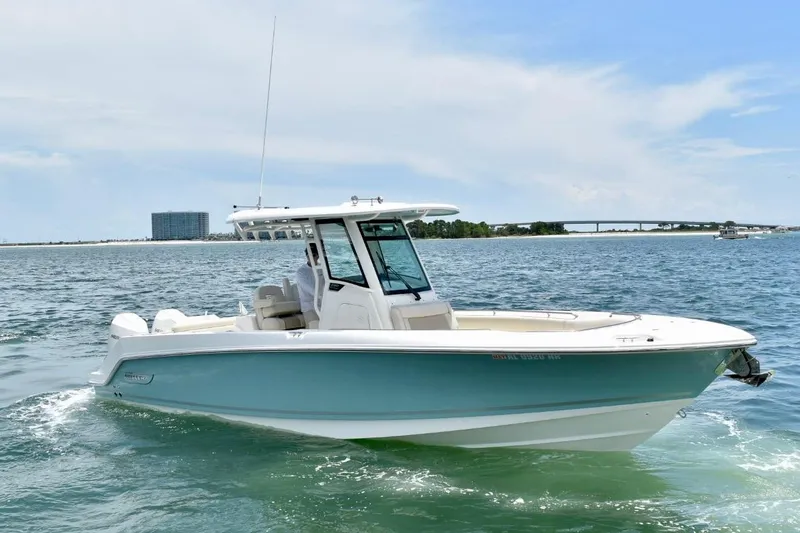  Yacht Photos Pics 2023 Boston Whaler 280 Outrage boat cruising on open water under a clear sky.