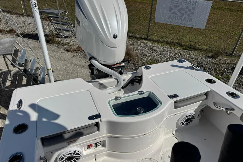  Yacht Photos Pics 2024 Everglades 243 Center Console boat with Yamaha engine, featuring a sleek deck design.