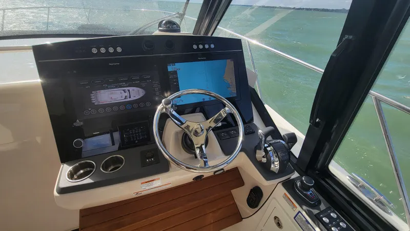  Yacht Photos Pics 2021 Boston Whaler 405 Conquest helm with advanced navigation displays and steering wheel.