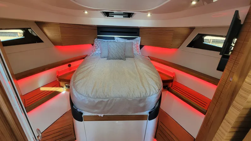  Yacht Photos Pics Luxurious cabin interior of 2021 Boston Whaler 405 Conquest with ambient red lighting.