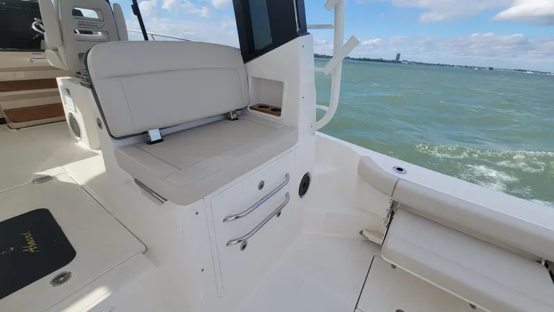  Yacht Photos Pics 2021 Boston Whaler 405 Conquest interior with seating, ocean view, and clear skies.