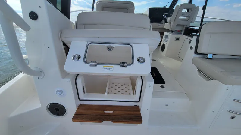  Yacht Photos Pics 2021 Boston Whaler 405 Conquest interior with seating and storage compartments.