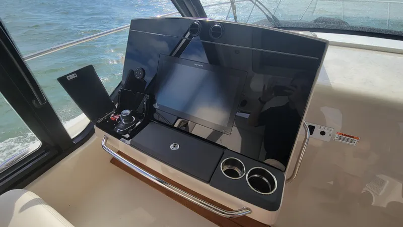  Yacht Photos Pics Helm of 2021 Boston Whaler 405 Conquest with modern navigation controls.