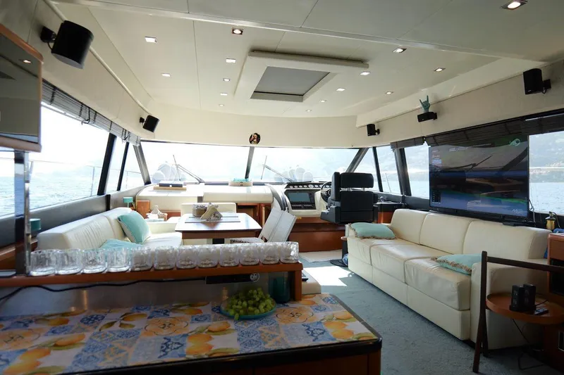 Grace Yacht Photos Pics Luxurious interior of a 2013 Prestige 620 yacht with elegant seating and panoramic windows.