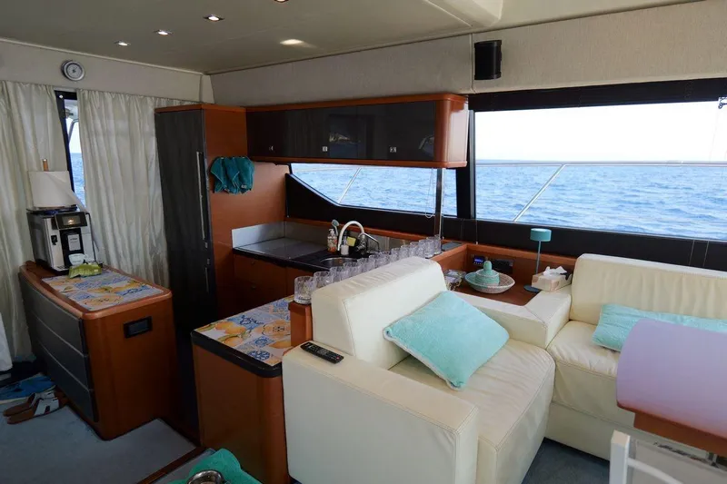 Grace Yacht Photos Pics Luxurious interior of 2013 Prestige 620 yacht with modern kitchen and comfortable seating.