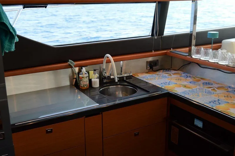 Grace Yacht Photos Pics Luxurious kitchen area on a 2013 Prestige 620 yacht with ocean view.