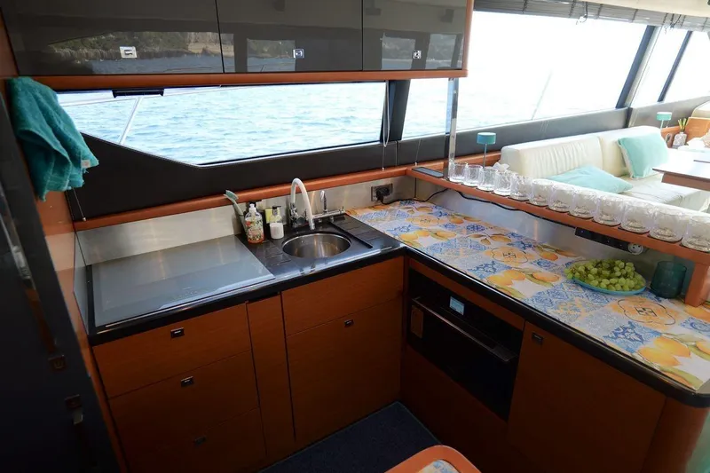 Grace Yacht Photos Pics Luxurious kitchen interior of 2013 Prestige 620 yacht with modern amenities and ocean view.