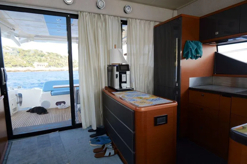 Grace Yacht Photos Pics Interior of 2013 Prestige 620 yacht with kitchen and ocean view.