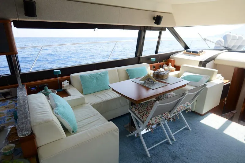Grace Yacht Photos Pics Luxurious interior of 2013 Prestige 620 yacht with ocean view and elegant seating area.