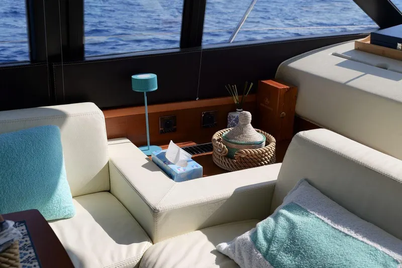 Grace Yacht Photos Pics Luxurious interior of 2013 Prestige 620 yacht with elegant seating and ocean view.