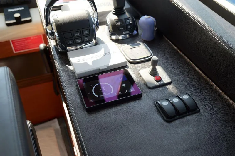 Grace Yacht Photos Pics Control panel of a 2013 Prestige 620 yacht with navigation and communication devices.