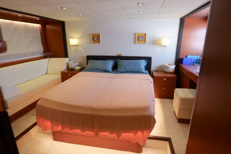 Grace Yacht Photos Pics Luxurious bedroom interior of 2013 Prestige 620 yacht with cozy bed and elegant decor.
