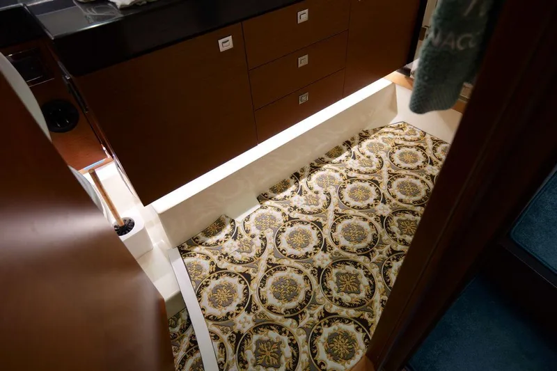 Grace Yacht Photos Pics Luxurious interior of 2013 Prestige 620 yacht with ornate patterned flooring.