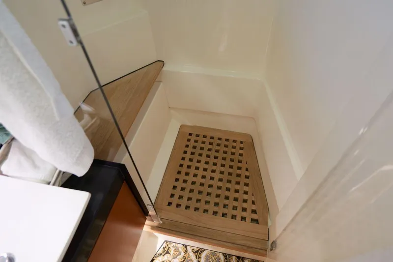 Grace Yacht Photos Pics Shower area in 2013 Prestige 620 yacht with wooden floor grate.
