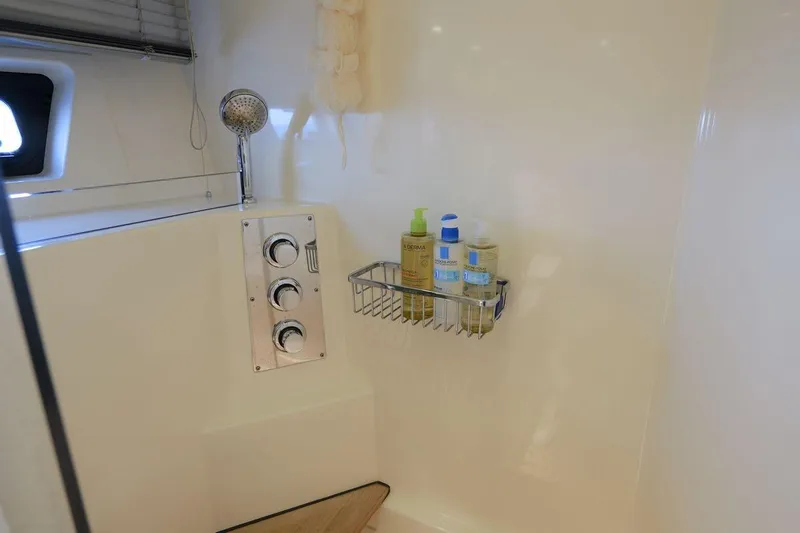 Grace Yacht Photos Pics Shower area in 2013 Prestige 620 yacht with toiletries and controls.