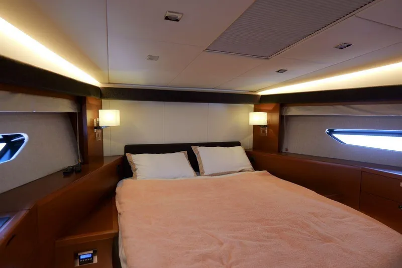 Grace Yacht Photos Pics Luxurious bedroom interior of 2013 Prestige 620 yacht with cozy lighting and modern design.