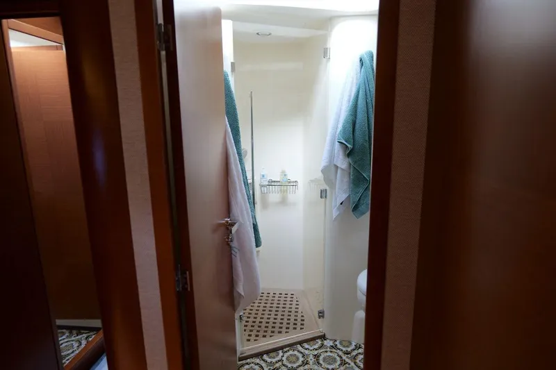 Grace Yacht Photos Pics Bathroom interior of 2013 Prestige 620 yacht with towels and shower area.