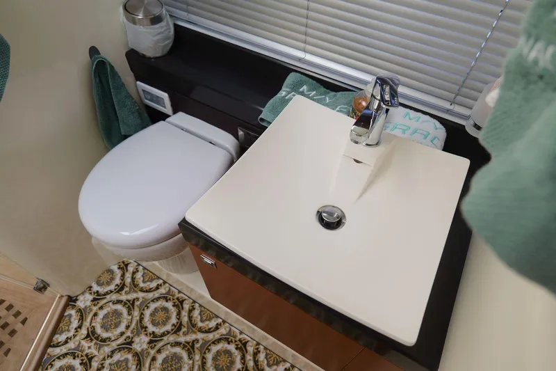 Grace Yacht Photos Pics Bathroom interior of 2013 Prestige 620 yacht with modern sink and toilet.