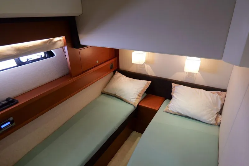 Grace Yacht Photos Pics Twin cabin interior of 2013 Prestige 620 yacht with modern lighting.