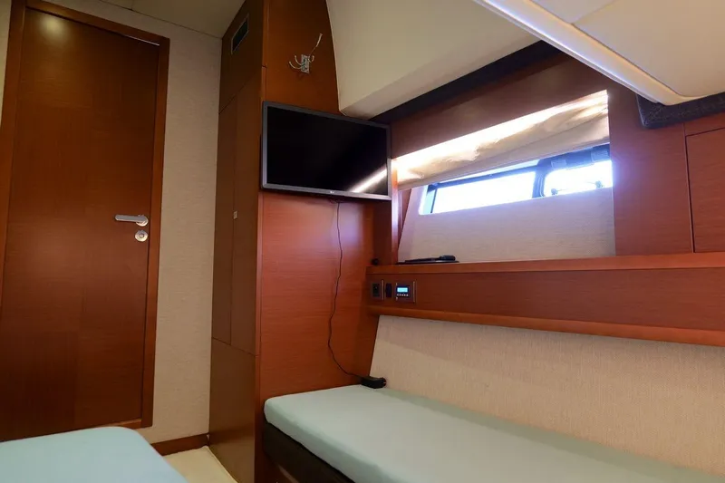 Grace Yacht Photos Pics Luxurious cabin interior of 2013 Prestige 620 yacht with TV and window.