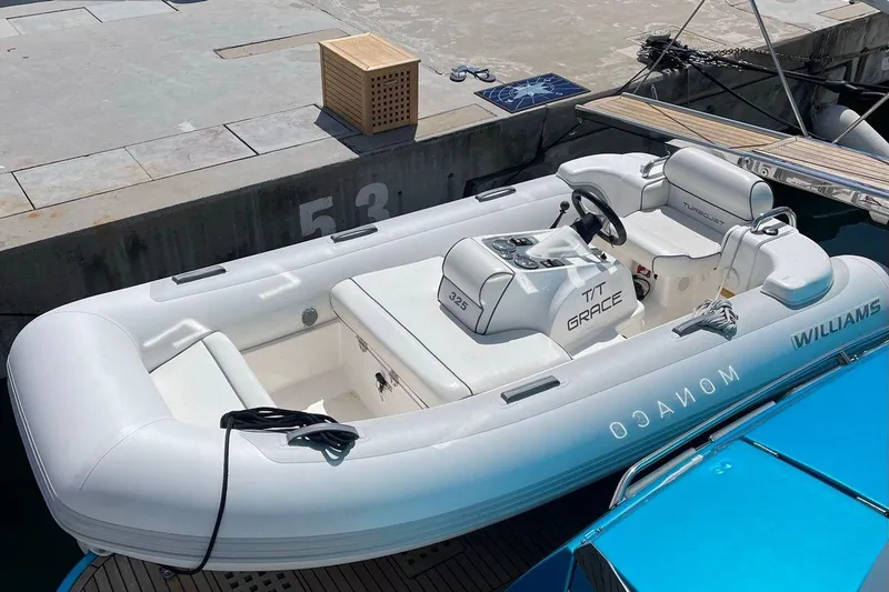 Grace Yacht Photos Pics Inflatable boat docked at marina, featuring Williams branding and sleek white design.