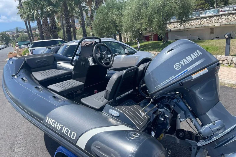 Grace Yacht Photos Pics Inflatable boat with Yamaha engine, parked outdoors, featuring Highfield branding.