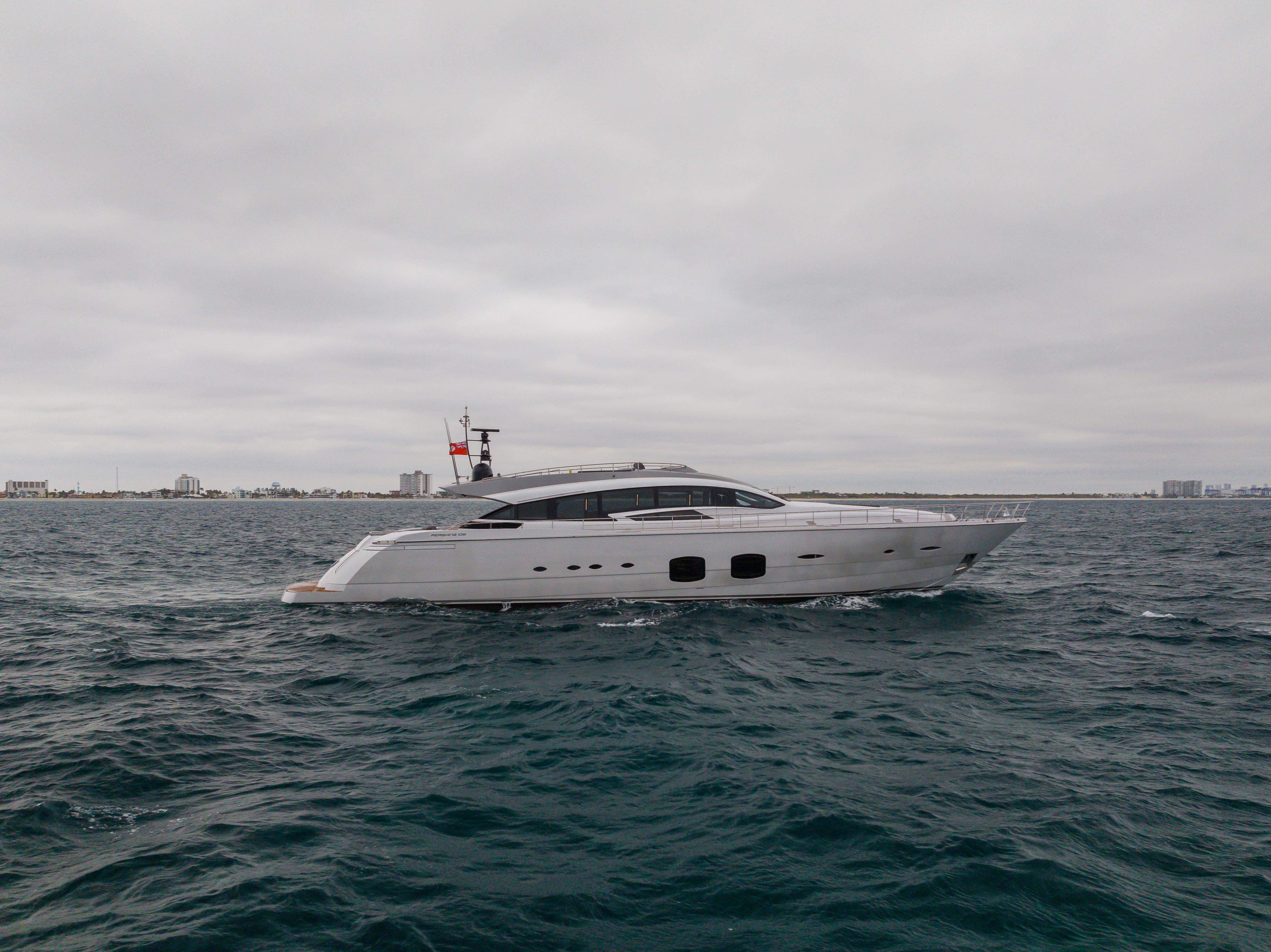2018 Pershing 108 yacht cruising on open water under cloudy skies.