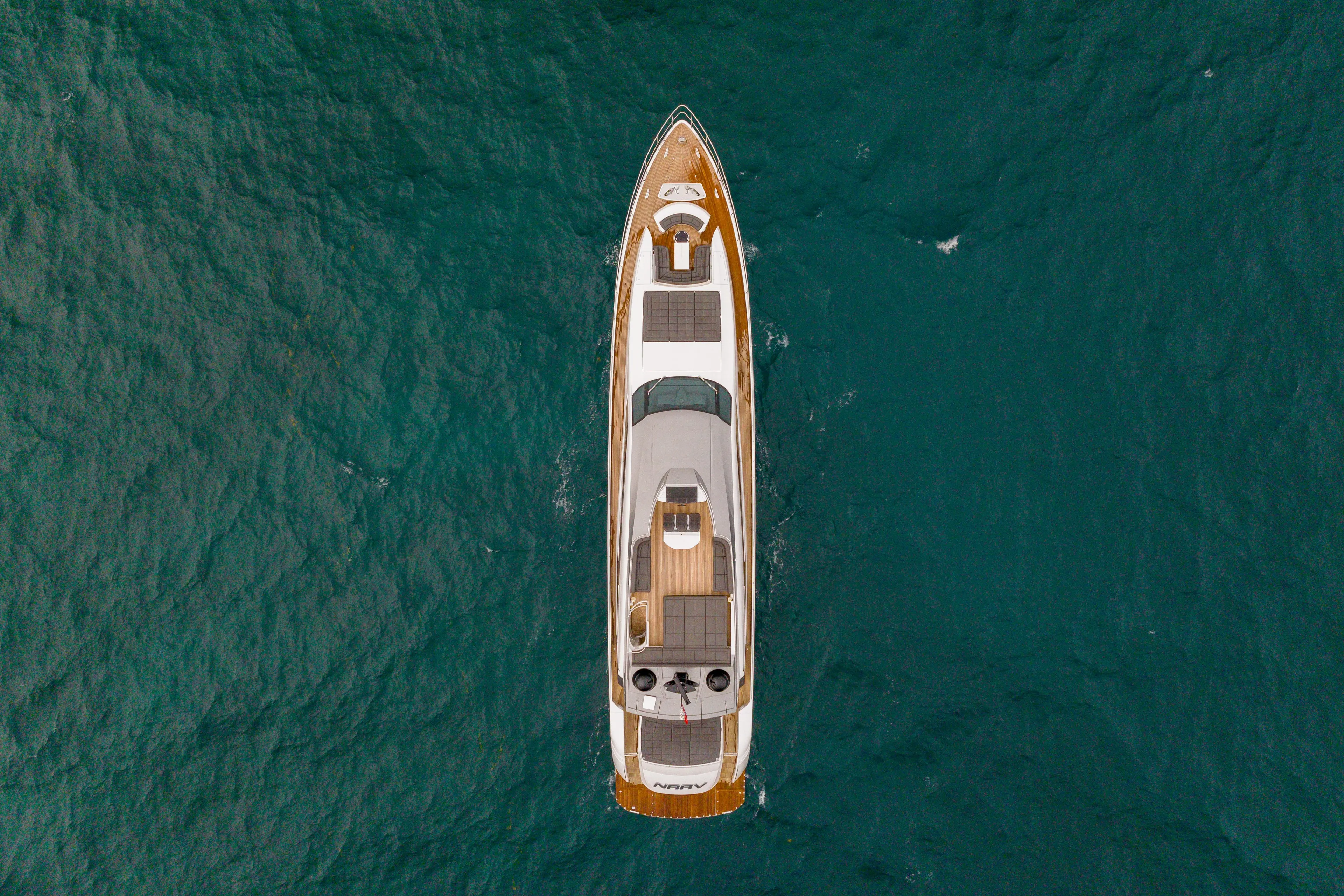 Overhead view of 2018 Pershing 108 yacht on open sea.