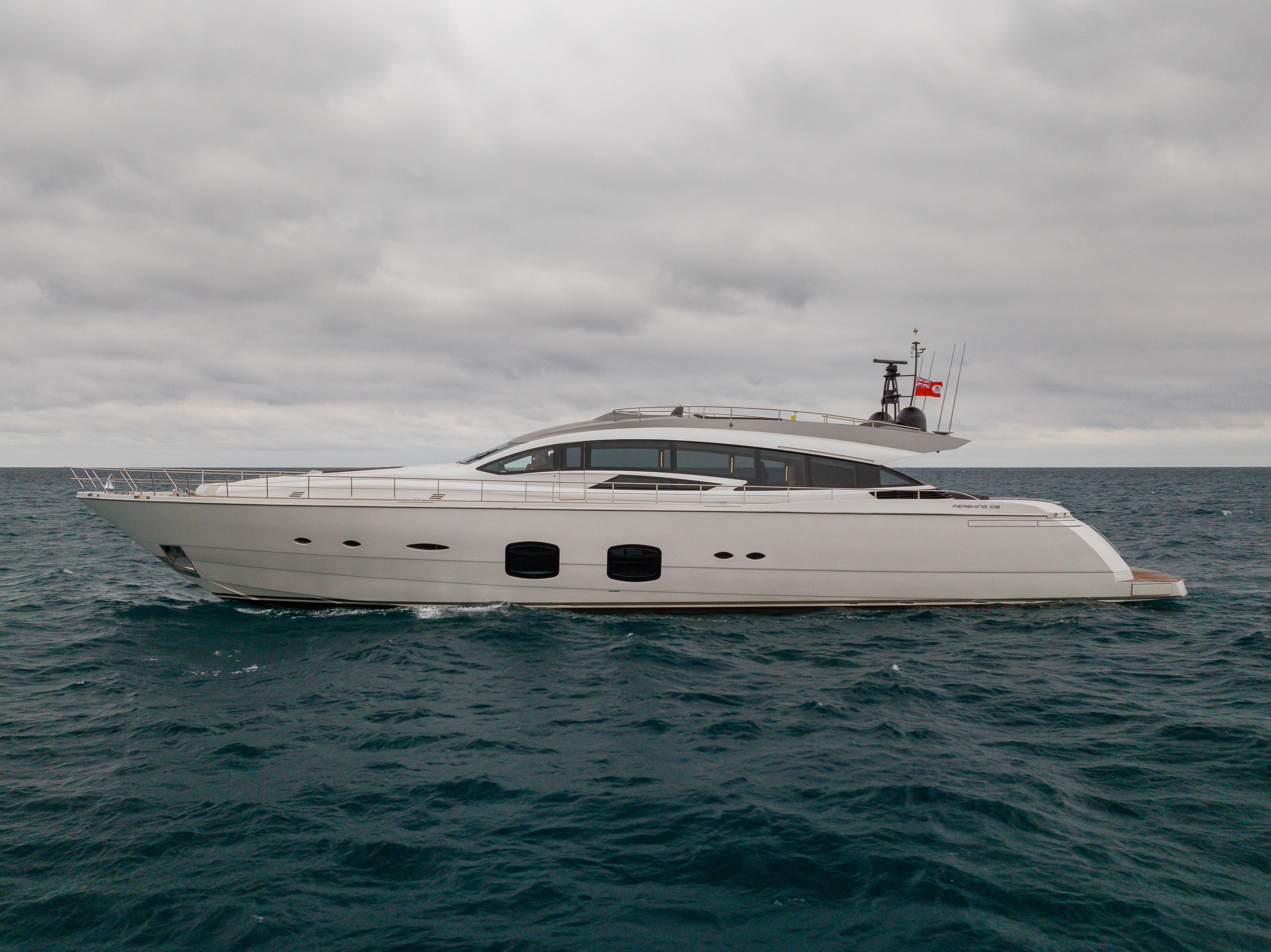 2018 Pershing 108 yacht cruising on open sea under cloudy skies.