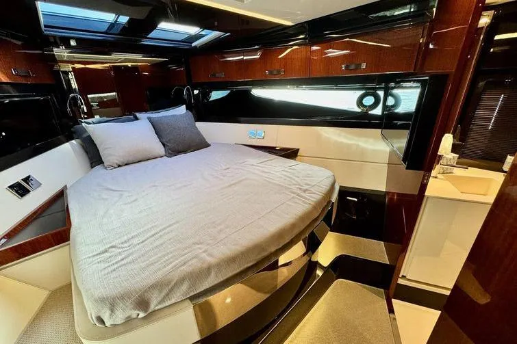  Yacht Photos Pics Luxurious bedroom interior of 2018 Riva 56' Rivale yacht with modern design.