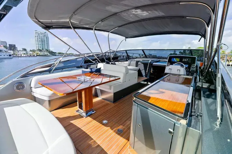  Yacht Photos Pics Luxurious 2018 Riva 56' Rivale yacht interior with elegant seating and polished wood finishes.