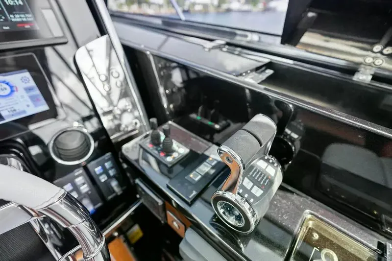  Yacht Photos Pics Control panel of a 2018 Riva 56' Rivale yacht, featuring modern navigation equipment.
