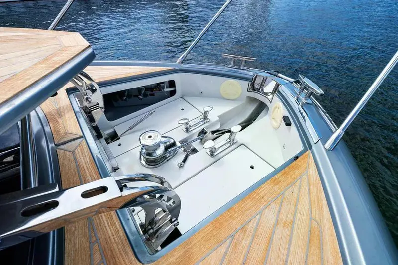  Yacht Photos Pics 2018 Riva 56' Rivale yacht deck with polished metal fittings and wooden accents.