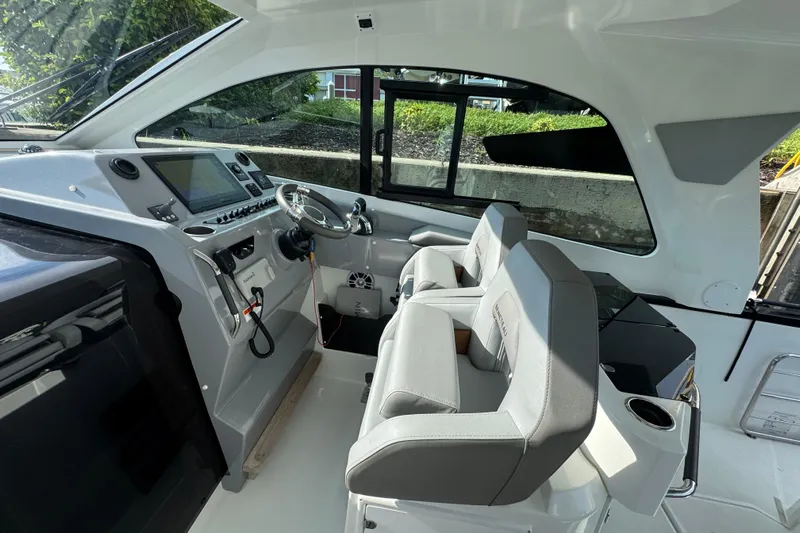  Yacht Photos Pics Interior of 2022 Beneteau Gran Turismo 32 yacht with modern helm and seating.