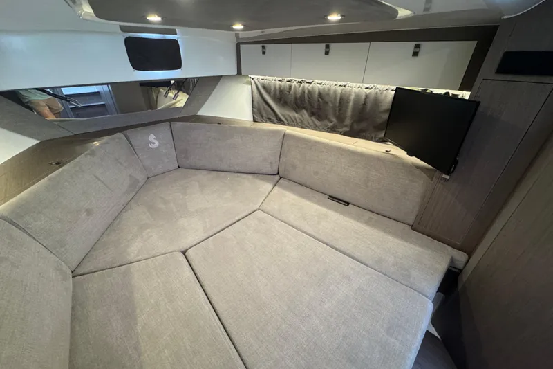 Yacht Photos Pics Interior of 2022 Beneteau Gran Turismo 32 with cozy seating and TV.