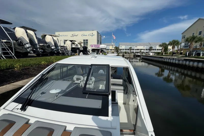  Yacht Photos Pics 2022 Beneteau Gran Turismo 32 docked at marina, showcasing sleek design and modern features.