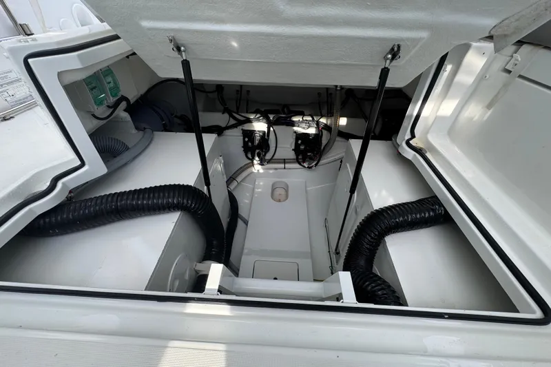  Yacht Photos Pics Engine compartment of 2022 Beneteau Gran Turismo 32, showcasing mechanical components and wiring.