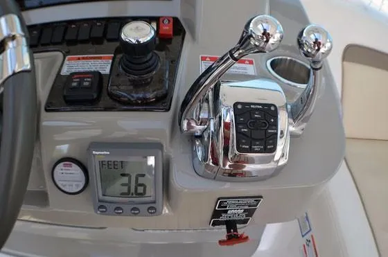  Yacht Photos Pics Control panel of 2012 Sea Ray 540 Sundancer yacht with digital display and throttle levers.