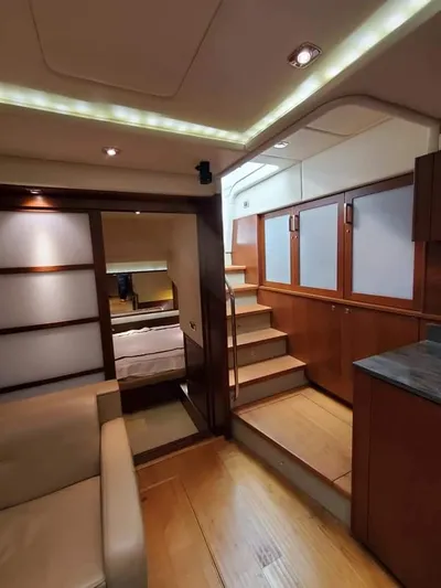  Yacht Photos Pics Luxurious interior of 2012 Sea Ray 540 Sundancer yacht with modern wood finishes.