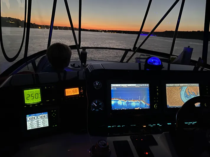 Cheri Pie Yacht Photos Pics 2008 Sea Ray 47 Sedan Bridge cockpit at sunset with navigation screens.