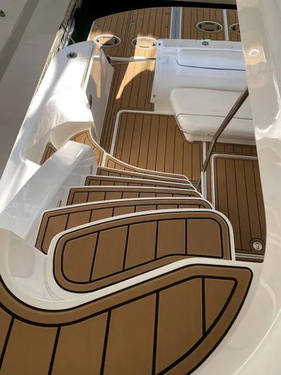Cheri Pie Yacht Photos Pics Staircase on 2008 Sea Ray 47 Sedan Bridge with teak flooring and white accents.