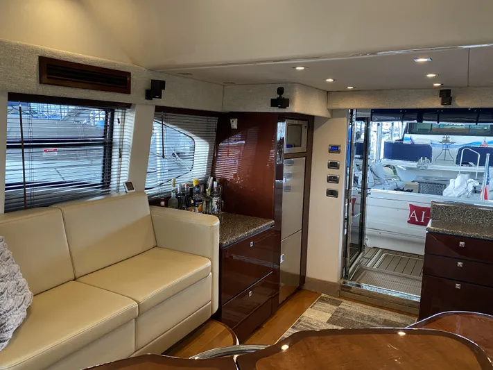 Cheri Pie Yacht Photos Pics Interior of 2008 Sea Ray 47 Sedan Bridge yacht with modern furnishings and open deck view.