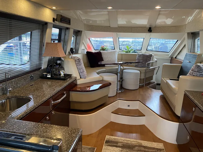 Cheri Pie Yacht Photos Pics Luxurious interior of 2008 Sea Ray 47 Sedan Bridge yacht with elegant seating and modern kitchen.
