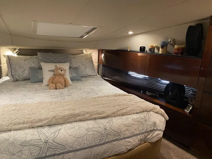 Cheri Pie Yacht Photos Pics Luxurious bedroom interior of 2008 Sea Ray 47 Sedan Bridge yacht with plush bedding.